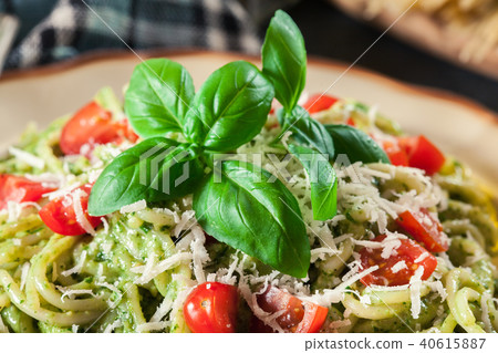 Vegetarian pasta spaghetti with basil pesto 40615887