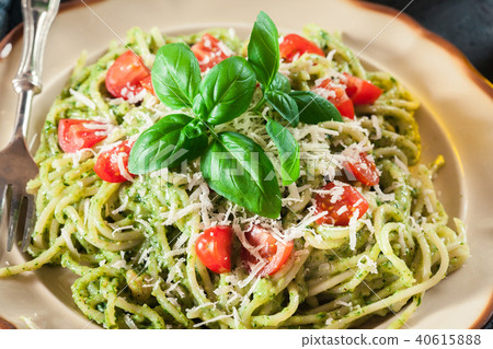 Vegetarian pasta spaghetti with basil pesto 40615888
