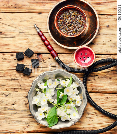 Oriental tobacco hookah with floral jasmine aroma Oriental tobacco hookah with floral jasmine aroma 40616531