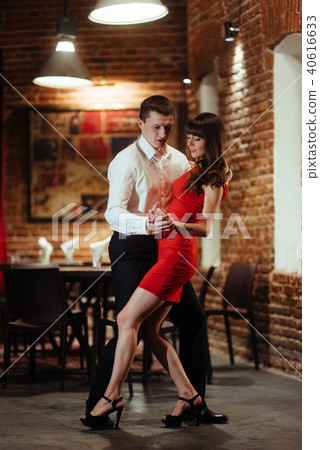 Dancing young couple on a white background. Passionate salsa dan Dancing young couple on a white background. Passionate salsa dan 40616633