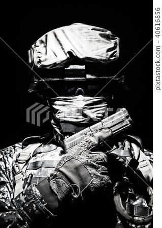 Portrait of commando with service pistol in hand 40616856