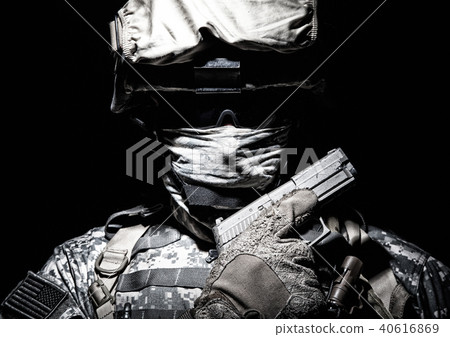 Portrait of commando with service pistol in hand 40616869