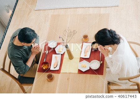 Japanese middle-class couple who eats breakfast on the dining table 40617443
