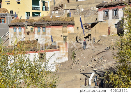 Villagers on a walk in the village of Kibal village white walls in Spiti Valley, mountainous region of India Villagers on a walk in the village of Kibal village white walls in Spiti Valley, mountainous region of India 40618551
