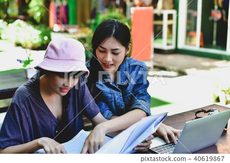 Travel Concept. A tourist girl searching for accommodation on th 40619867