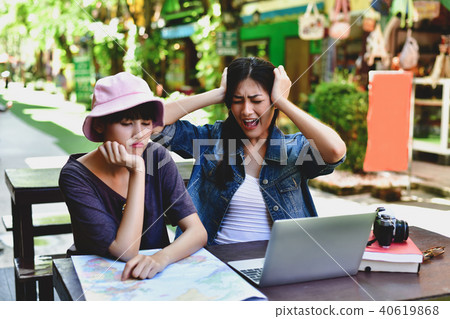 Travel Concept. A tourist girl searching for accommodation on th 40619868