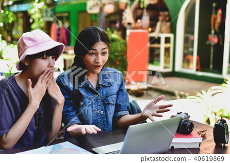 Travel Concept. A tourist girl searching for accommodation on th 40619869