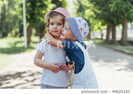 portrait of a little girl and her brother. 40620195