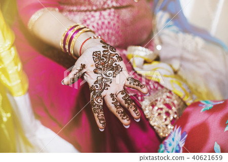 Indian women showing beautiful art henna (mehndi) Indian women showing beautiful art henna (mehndi) 40621659