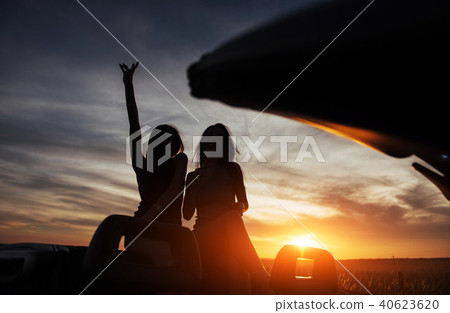 Young two women at a photo shoot. Girls gladly posing 40623620