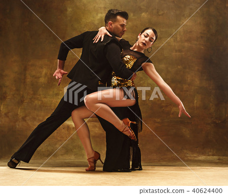 Dance ballroom couple in gold dress dancing on... - Stock Photo [40624400]  - PIXTA