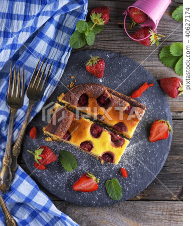 two pieces of cheesecake with strawberries two pieces of cheesecake with strawberries 40627174