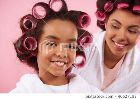 Beautiful mother and daughter in bathrobes 40627182