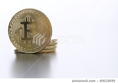 Golden Bitcoin facing the camera in sharp focus, closeup Golden Bitcoin facing the camera in sharp focus, closeup 40628699