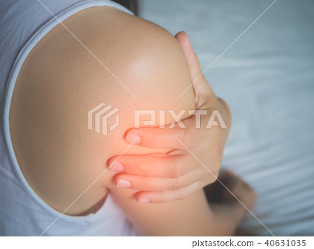 woman suffering from pain in arm. woman suffering from pain in arm. 40631035