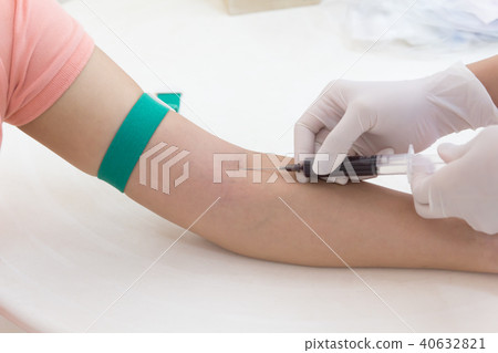 Laboratory with nurse taking blood sample from patient Laboratory with nurse taking blood sample from patient 40632821
