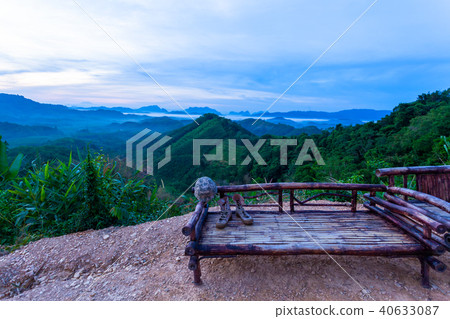 military hat and military shoes on bamboo chair 40633087