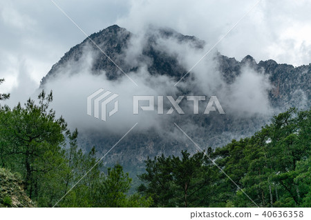 Mountain peak in the clouds 40636358