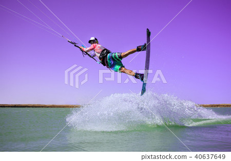 Kite surfer rides ideal flat water of the lake 40637649