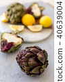 Healthy lifestyle. Artichokes on gray tabletop 40639004