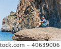 traveller with backpack in picturesque bay 40639006