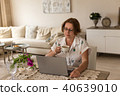 Freelance and home office concept.  Woman working from home offi 40639010