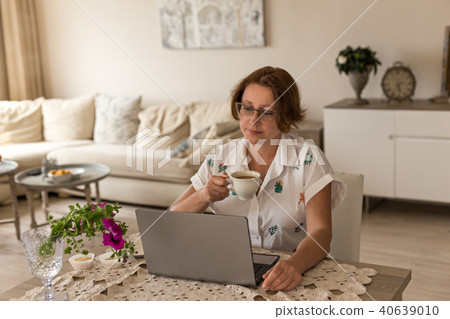 Freelance and home office concept. Woman working from home offi Freelance and home office concept. Woman working from home offi 40639010