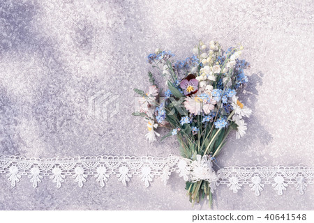 bouquet laying on an old rustic silver table 40641548
