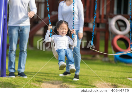 Happy daughter is enjoying to play with parents. Happy daughter is enjoying to play with parents. 40644779