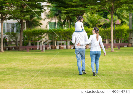 Asian girl on neck parents big happy laughing. 40644784