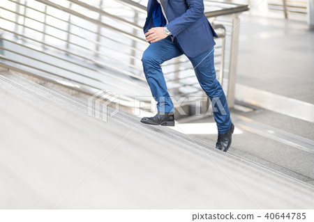 Businessman rush up the stairs to make time. 40644785