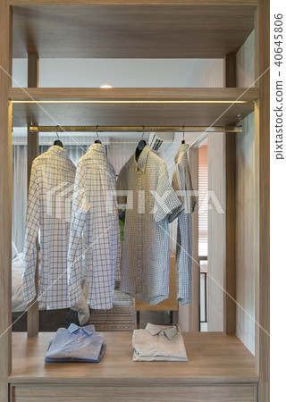 clothes hanging on rail in modern wardrobe clothes hanging on rail in modern wardrobe 40645806