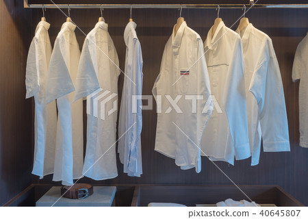 row of white shirts on rail row of white shirts on rail 40645807