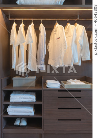 row of white shirts on rail 40645808