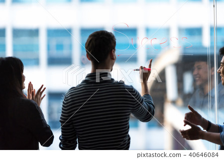 Business people celebrating success at workplace. Business people celebrating success at workplace. 40646084