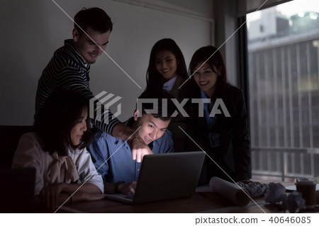 Businesspeople are working with laptop overtime. Businesspeople are working with laptop overtime. 40646085