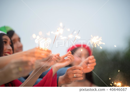Group of friends having fun with sparklers. Group of friends having fun with sparklers. 40646087