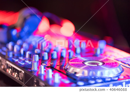 Motionblur of Dj hands on equipment deck and mixer Motionblur of Dj hands on equipment deck and mixer 40646088