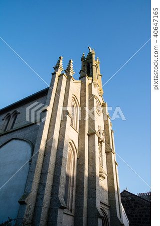A large stone church standing beneath a deep blue sky at Penzance, a town southwest of England A large stone church standing beneath a deep blue sky at Penzance, a town southwest of England 40647165