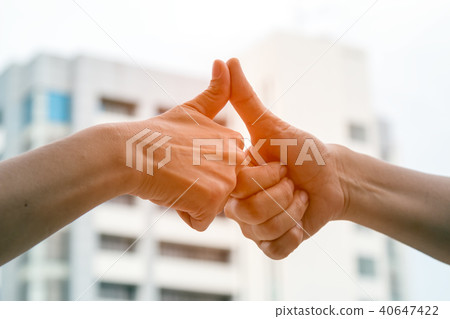 Close up of Thumb finger touching from 2 men Close up of Thumb finger touching from 2 men 40647422