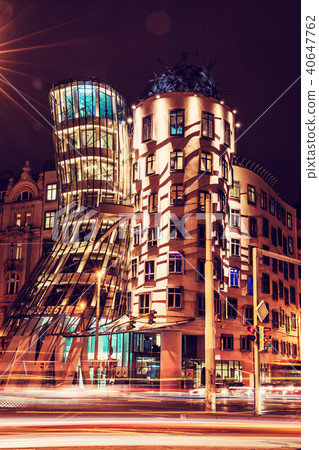 Dancing house with traffic in Prague, red filter Dancing house with traffic in Prague, red filter 40647762