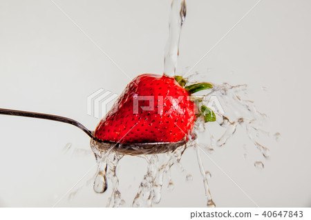 Washing a Strawberry Washing a Strawberry 40647843