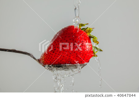 Washing a Strawberry 40647844