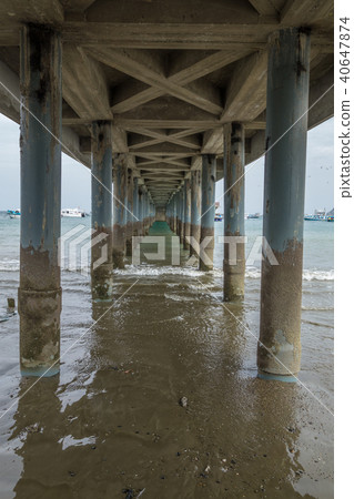 Underneath a fishing pier 40647874