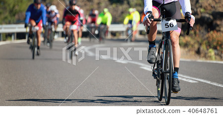 Cycling competition cyclist athletes riding a race 40648761