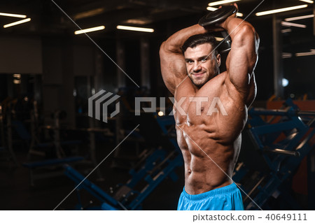 Handsome model muscle man abs workout in gym 40649111