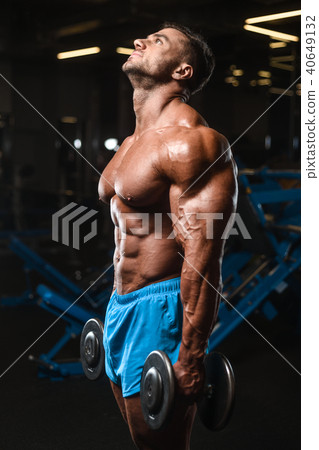 Handsome model muscle man abs workout in gym Handsome model muscle man abs workout in gym 40649132