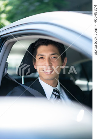 Driving car outsider businessman Driving car outsider businessman 40649874