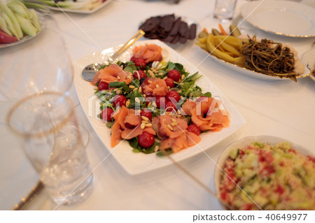 beautifully decorated white table with festive food beautifully decorated white table with festive food 40649977