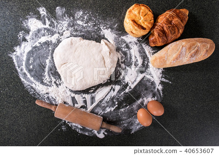 Raw dough for bread with ingredients on black background, top vi Raw dough for bread with ingredients on black background, top vi 40653607